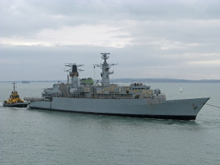 Large ship tug boat smaller - a tug free wallpaper