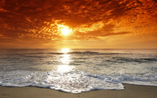 Sunset ocean waves red sky 3 - a sunset over the ocean free wallpaper