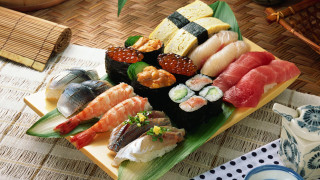 Sushi plate bamboo mat tea - a plate of sushi free wallpaper
