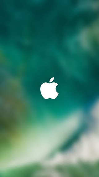 Blurry apple logo green background - a green background free wallpaper for mobile