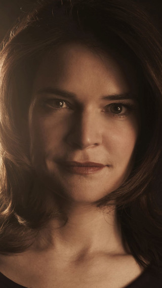 Serious woman expression shoulders focused - her face and shoulders free wallpaper