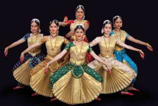 Indian dance costumes group posing - their arm free wallpaper