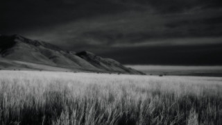 Black white field mountains clouds 2 - photo of a field free wallpaper
