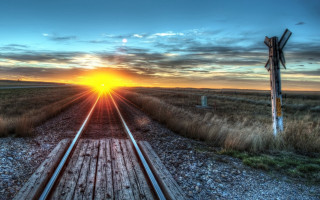 Train track sunset signpost distance 2 - the side of the track free wallpaper