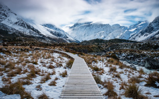 Wooden walkway snowy field mountains - alson s. clark free wallpaper for desktop