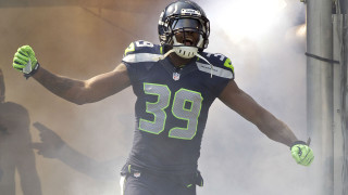 Football player hands up helmet - a helmet and gloves free wallpaper