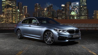 Silver car city skyline night 7 - a city skyline in the background free wallpaper