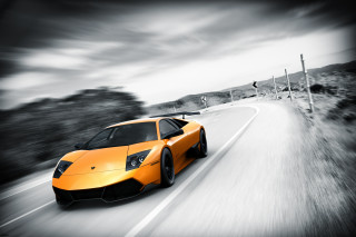 Yellow sports car cloudy road - a yellow sports car free wallpaper for desktop