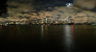 City skyline night water boat 5 - a full moon in the distance free wallpaper