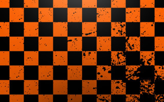 Black orange checkered grungy background - a grungy effect free wallpaper