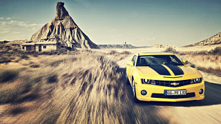 Yellow car dirt road mountains - a dirt road next free wallpaper