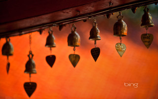 Bells hanging wooden beam red - free light wallpaper