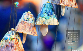 Calendar colorful objects hanging bird - an abstract sculpture free wallpaper