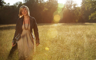 Woman field grass trees sunlight - a woman in a field free wallpaper