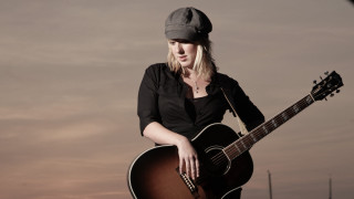 Woman holding guitar black shirt - a hat free wallpaper