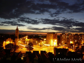 City night clock tower cloudy - a clock tower in the distance free wallpaper