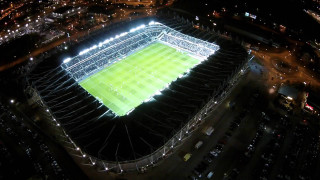 Aerial night stadium green field - a stadium in the background free wallpaper