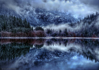 Snowy mountain lake trees fog - reflective free wallpaper