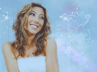 Woman white dress smiling blue - a blue background behind her free wallpaper for desktop