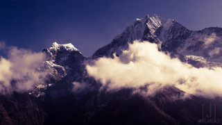 Mountain clouds snow sunny day - a blue sky above free wallpaper
