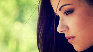 Woman longhair blackshirt greenbackground blurrytree - a black shirt free wallpaper