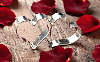 Hearts wooden table red flowers 5 - a couple of hearts free wallpaper for desktop