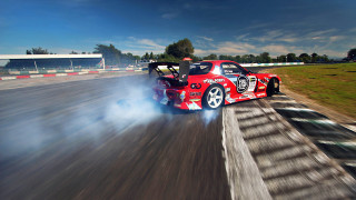 Red car race track smoke - a race track free wallpaper