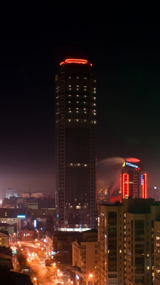 City skyline night lit tower - edi rama free wallpaper for mobile