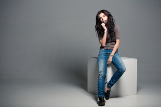 Woman sitting concrete block posing - contemporary free wallpaper