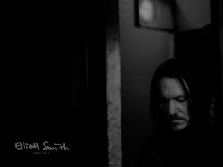 Man long hair doorway looking - studio portrait free wallpaper for desktop