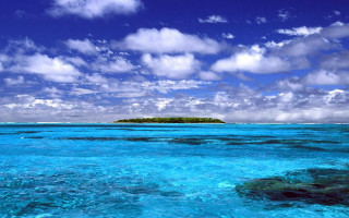 Small island cloudy sky blue - a blue ocean below free wallpaper for desktop