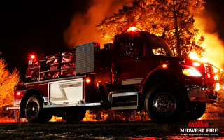 Fire truck driving woods night - a fire truck free wallpaper