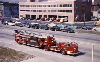 Fire truck parked building background - a fire truck free wallpaper