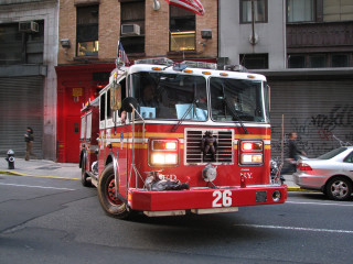Fire truck driving street tall - a fire truck free wallpaper