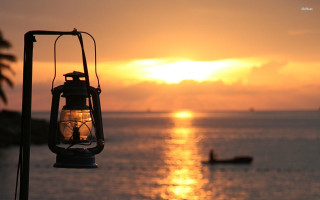 Lantern ocean sunset mountain reflection - a lantern free wallpaper
