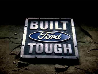Built ford tough sign dark - side of a building free wallpaper