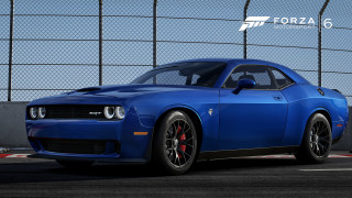 Blue sports car parked fenced - a blue sports car free wallpaper