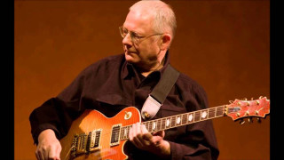 Man playing guitar on stage 6 - his hand and a microphone free wallpaper