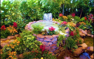 Garden fountain flowers plants rocks - a fountain free wallpaper for desktop