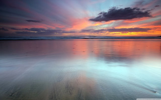 Sunset beach water clouds footprints - the sand free wallpaper