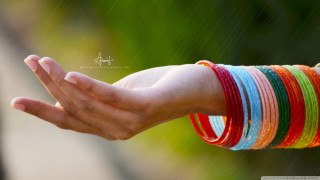 Person holding bracelets blurry background - a person holding free wallpaper