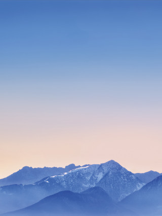 Mountain range snow capped pink - a pink sky in the background free wallpaper for mobile