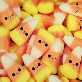 Candy corn faces drawn eyes - free halloween wallpaper for tablet