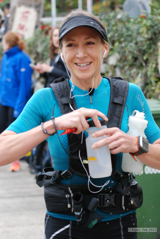 Woman blue shirt black hat - full round face free wallpaper