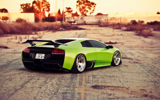 Green sports car desert sunset - vibrant color free wallpaper