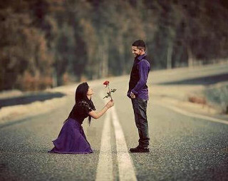 Man kneeling woman holding flower - the side of the road free wallpaper for desktop