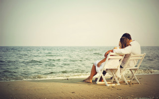Couple beach ocean sitting summer - a couple sitting free wallpaper