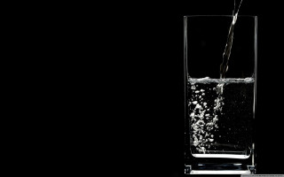 Glass water pour black background - a glass of water free wallpaper for desktop