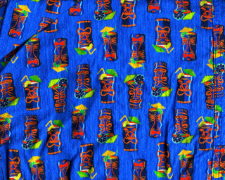 Blue tiki masks green leaf - a green leafy plant free wallpaper for desktop