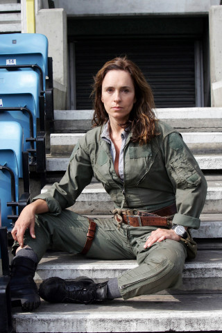 Woman uniform sitting steps legs - free portrait wallpaper